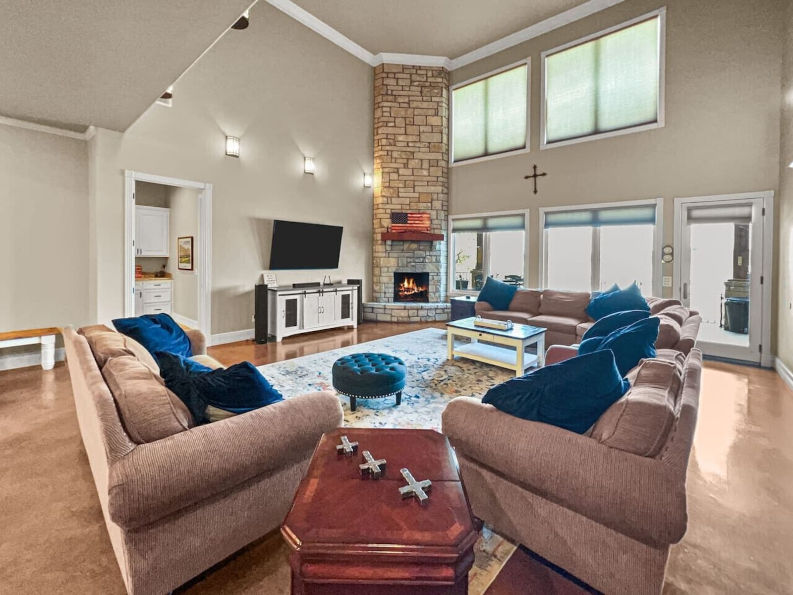 Great room with soaring vaulted ceilings and a towering stone fireplace